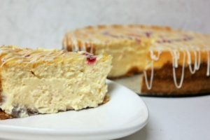 Baked White Chocolate Cheesecake Recipe with a Raspberry Drizzle Heart